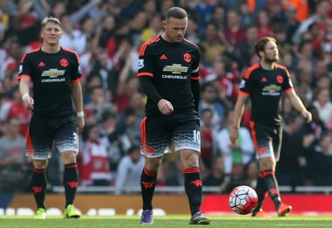 Bastian Schweinsteiger, Wayne Rooney and Daley Blind with heads down for Manchester United.