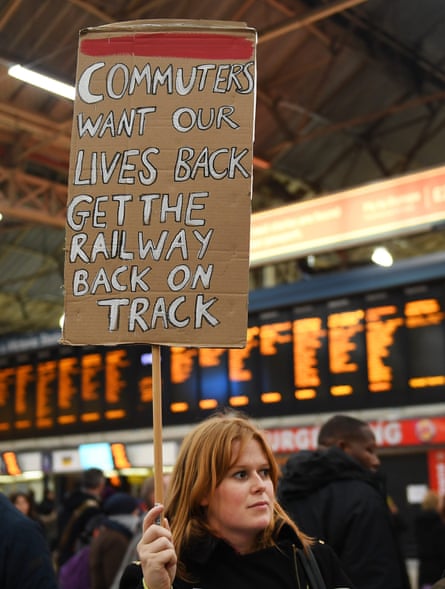 A commuter protests in support of Southern Rail staff. at Victoria Station in London.