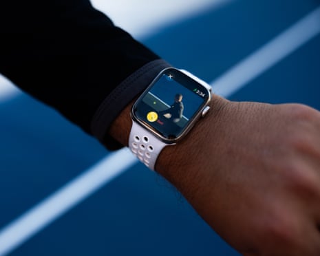 A wrist is shown with a smartwatch on