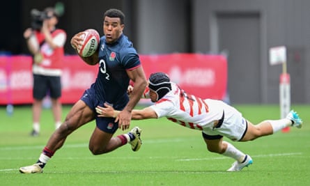 England’s Immanuel Feyi-Waboso tries to evade a tackle by Japan’s Koga Nezuka