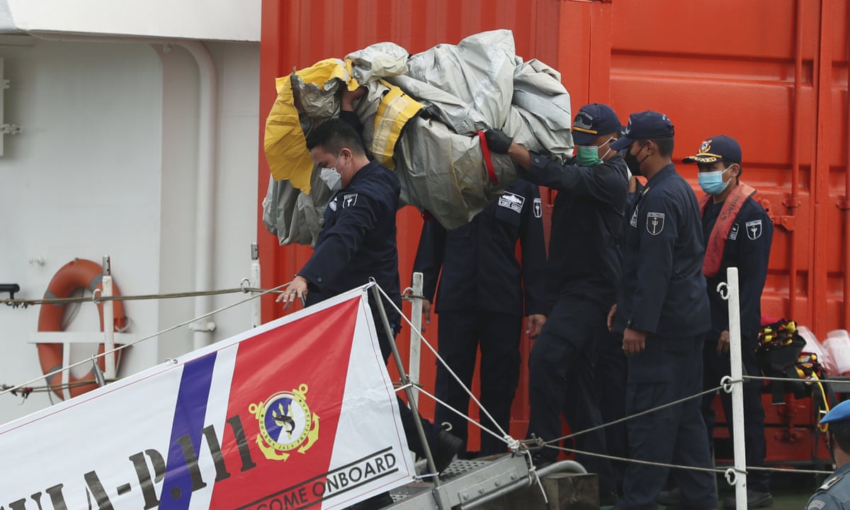 Indonesia Plane Crash Authorities Locate Black Boxes Among Wreckage Indonesia The Guardian