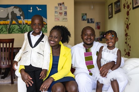 Hope with her husband, Patrick, and two children, Methuselah and Katrina, at home in Kampala, Uganda.