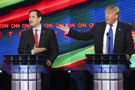 two men in suits on a debate stage