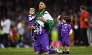 Sergio Ramo’s children join him on the pitch to celebrate Real Madrid’s victory.