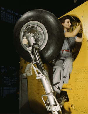 A worker at the Vultee plant in Nashville, Tennessee, makes adjustments in the wheel well of a Vengeance dive bomber in February 1943.