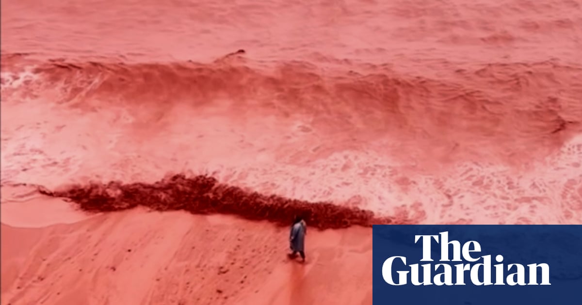 Rainfall creates crimson spectacle at beach on Iran's Hormuz Island