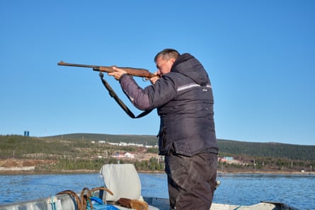 Martin Shiwak hunts a seal from his boat, on Lake Melville.