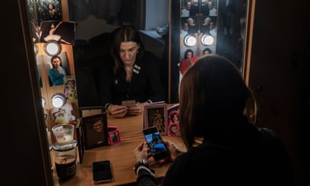 Ballerina Olga Kifyak-fon-Kraimer, whose older brother was killed during the battle for Bahmut, in her changing room in the National Opera of Ukraine. Photos of her brother and her father, who died earlier last year, decorate her table.