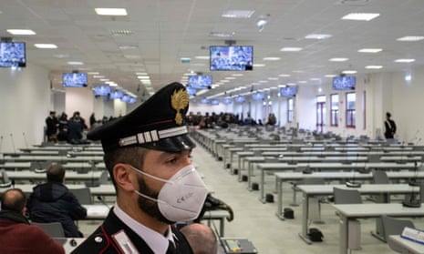 A Carabinieri police officer stands guard at the start of the trial of more than 350 alleged members of Calabria’s ‘Ndrangheta mafia group and associates