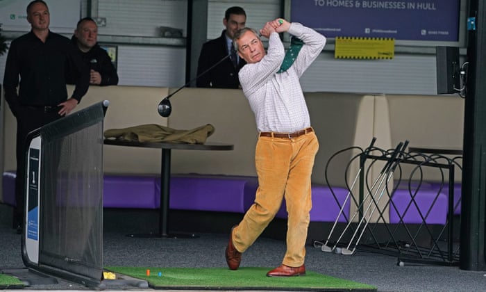Nigel Farage playing golf on a range at One Stop Golf in Hull.
