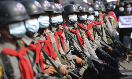 Armed riot police are seen near protesters in Naypyitaw, Myanmar 