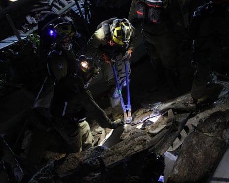 Israeli firefighters were searching for three missing people in the rubble of a residential building.