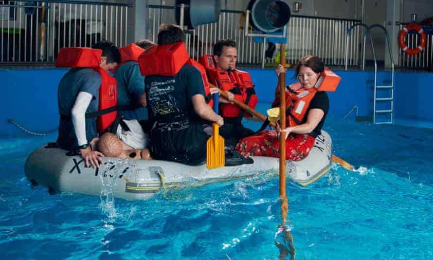 Rachel Hall with a group of journalists experiencing what it's like to try to cross the canal in a small dinghy at RNLI's Sea Survival Center in Poole,