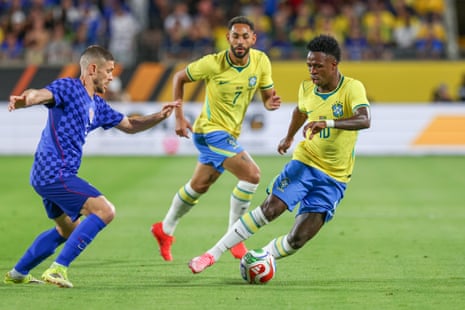 Vinícius Júnior (right) dribbles the ball past Andrej Kramaric during Brazil’s friendly match against Croatia in March