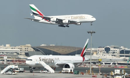An Emirates flight approaches for landing at Dubai airport