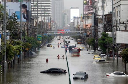 Cars submerged in flood waters along Phetchaburi Road in central Bangkok