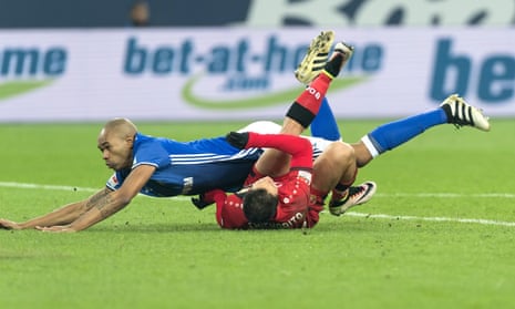 Schalke’s Naldo, top, earned a red card in the fourth minute for this foul on Bayer Leverkusen’s Javier Hernández.