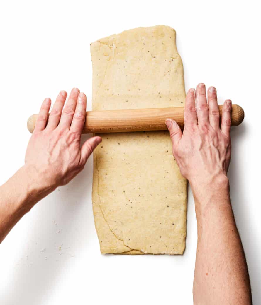 Step 6b: Turn the dough 90 degrees, then roll it out again, this time to about 50cm x 20cm, and cut horizontally into roughly 2½cm-wide strips.