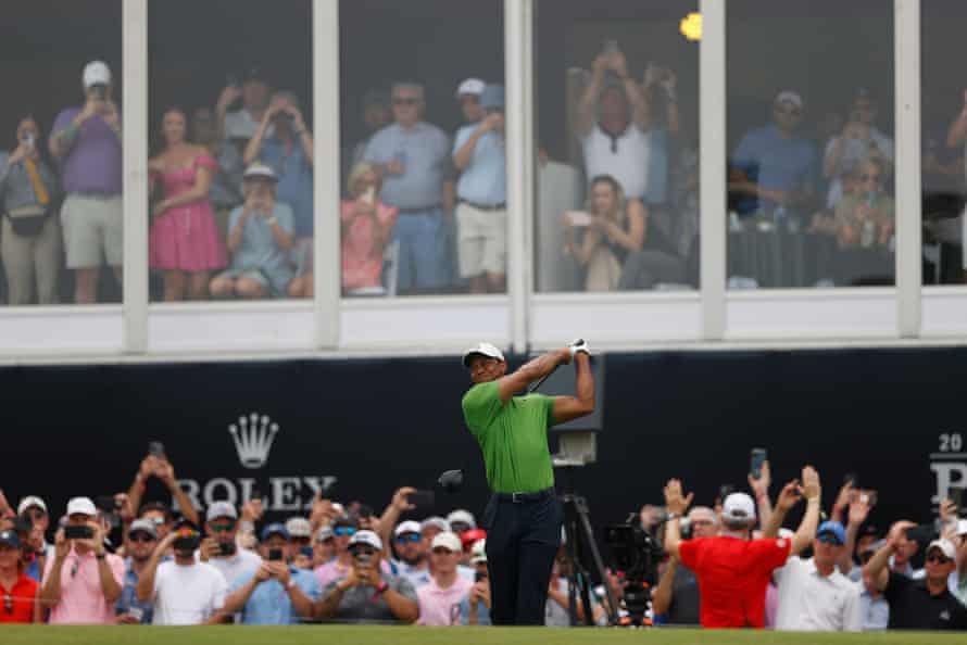 Tiger Woods hits his tee shot off the third.