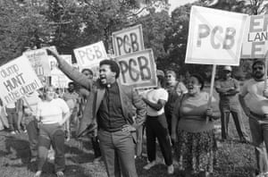 Rev. Ben Chavis, right, raises his fist as fellow protesters are taken to jail at the Warren County PCB landfill near Afton, North Carolina on Thursday, Sept. 16, 1982.