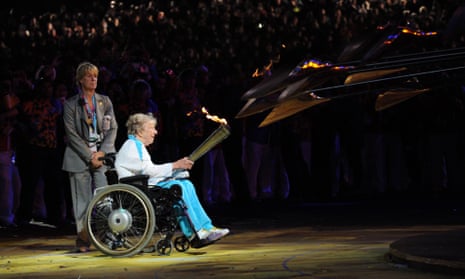 Margaret Maughan lights the cauldron bearing the Paralympic flame at the 2012 London Paralympic Games.