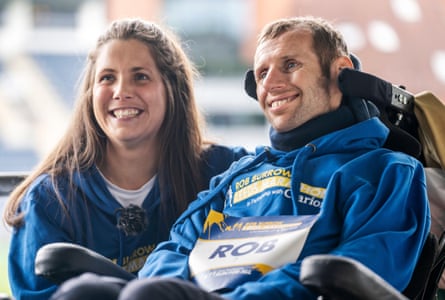 Rob Burrow successful a wheelchair, pinch his wife, Lindsey