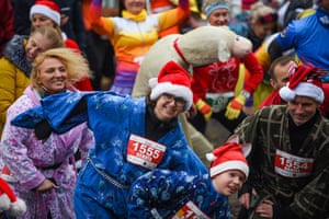 Krakow, Poland. Hundreds of people dressed in funny costumes take part in the New Year’s Eve run at the Small Market Square.