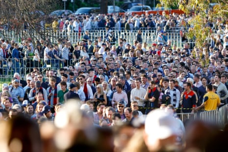 Fans queue outside the stadium