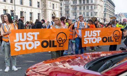 Just Stop Oil<br> The event billed as the final Just Stop Oil protest. The group slow marched from St James Park to the Royal Courts of Justice and then outside the Shell building on the Southbank where they symbolically took off their hi-vis bibs and hung them on a line outside.