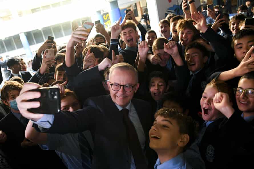 Albanese poses for a selfie with students during a visit to his old school at St Mary’s Cathedral school in Sydney