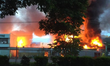 Fire engulfs a building in Port Moresby after riots broke out in the capital city of Papua New Guinea.