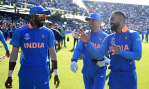India’s Hardik Pandya (left), MS Dhoni and Virat Kohli (right) chat after their 125 run victory.