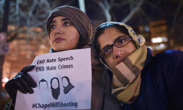 Women take part in a vigil for three young Muslims killed in Chapel Hill, North Carolina, this week.