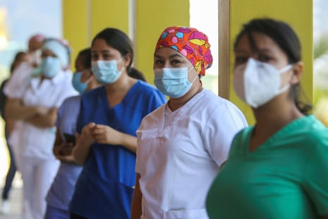 Health workers queue at the Hospital Maria to receive a dose of the Moderna coronavirus vaccine, in Tegucigalpa, Honduras on 25 February, 2021.