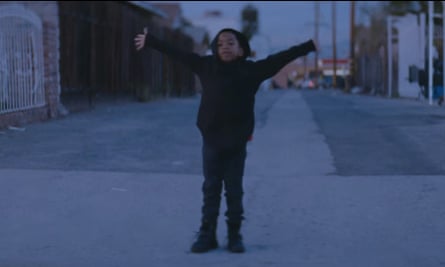 A child finishes his dance before a line of police officers dressed in riot gear, in the video for Beyoncé's new video, Formation