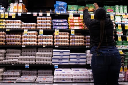 An employee stocks food at a Safeway supermarket.