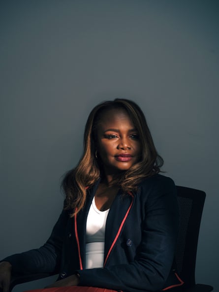 Woman wearing a blazer sitting on a chair