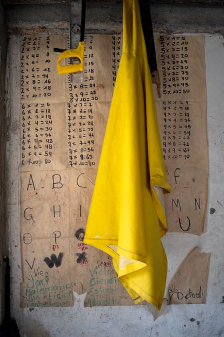 A poster of alphabet and multiplication tables in the living room of the Ayoví family at Playa de Oro. Parents have to create different learning resources for their children to face the struggles of home education
