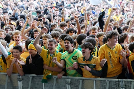 Socceroos fans react as Australia and Paraguay draw during a screening at Tumbalong Park in Sydney