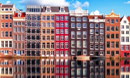 Row of smart-looking houses overlooking a canal in Amsterdam.