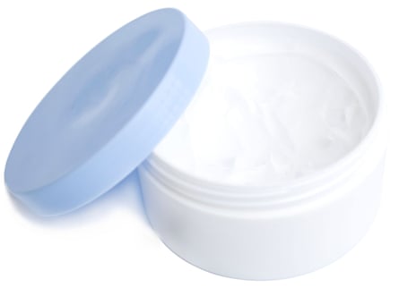 Opened container of face cream