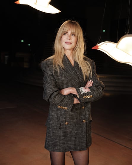 Nicole Kidman in front of suspended bird decorations
