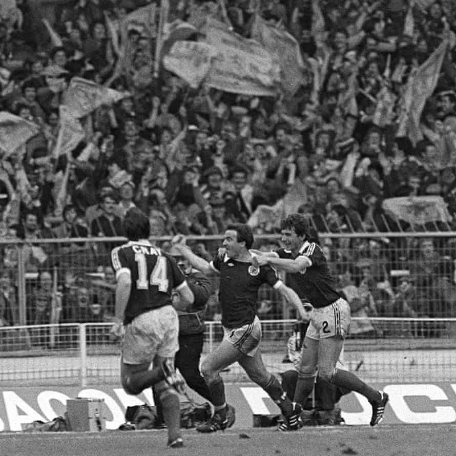Scotland’s John Robertson celebrates his goal with Ray Stewart in front of jubilant Scotland fans at Wembley in 1981