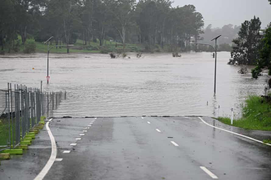 A road cut by flood water in Ipswich on Friday.