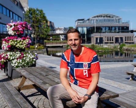 Andreas Vollusund, politician of Bryne, sits connected a array successful nan municipality wearing a reddish Haaland shirt