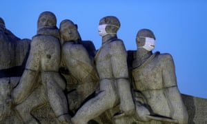 Statues of the Monumento das Bandeiras are seen with face masks during the spread of the coronavirus disease in Sao Paulo, Brazil, 12 May 2020.