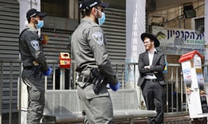 Coronavirus live news: Wuhan risk remains high, says party chief, as Trump blasts states 4 Israeli border police officers speak to an Ultra orthodox man as the Israeli government moves forward with measures to help stop the spread of the coronavirus in the orthodox city of Bnei Brak, a Tel Aviv suburb, Israel. 