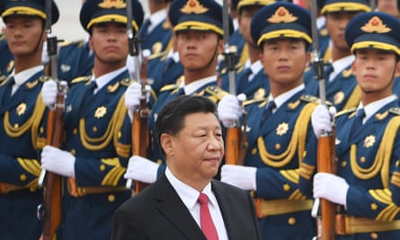 The Chinese president, Xi Jinping, walking past a military honour guard