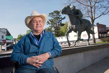 Ron Turcotte poses adjacent to a statue of him and Secretariat successful Grand Falls, New Brunswick, Canada, successful May 2023.