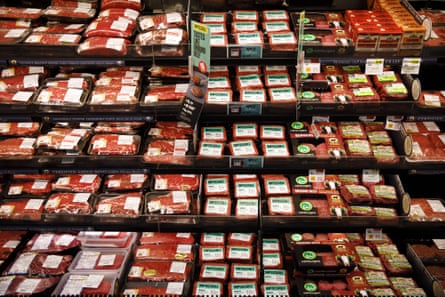 Packages of beef are displayed for sale alongside Impossible Burger plant-based meat in Los Angeles.